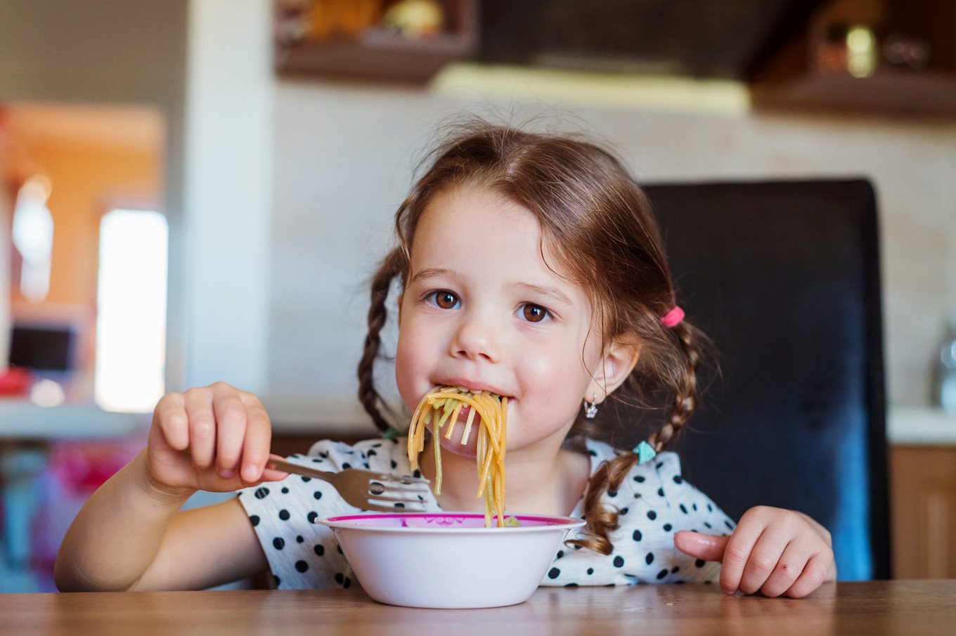 Toddler eating spaghetti