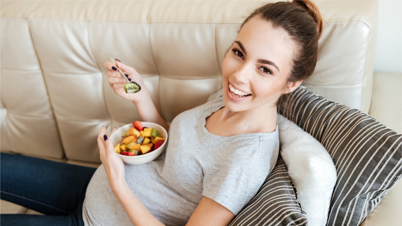Pregnant woman relaxing on a sofa