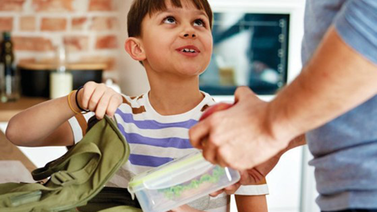Dad and son packing a lunchbox